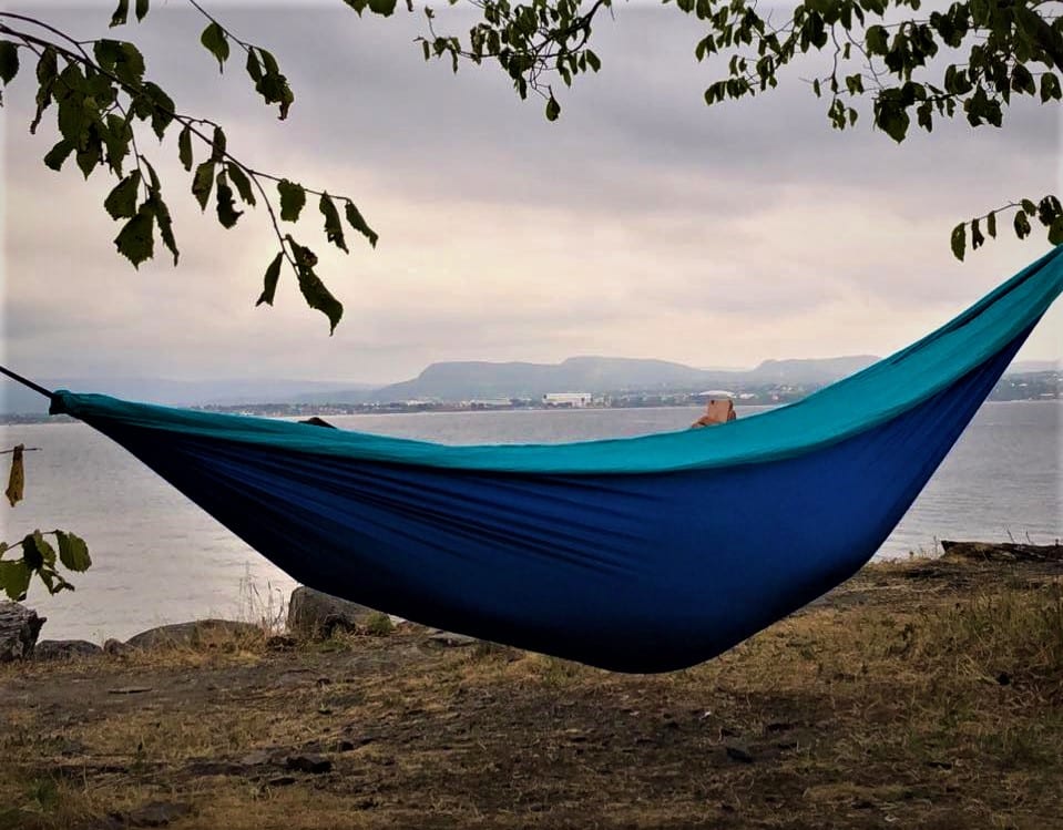 Relaxing in a purple and blue hammock on an island in the Oslo Fjord