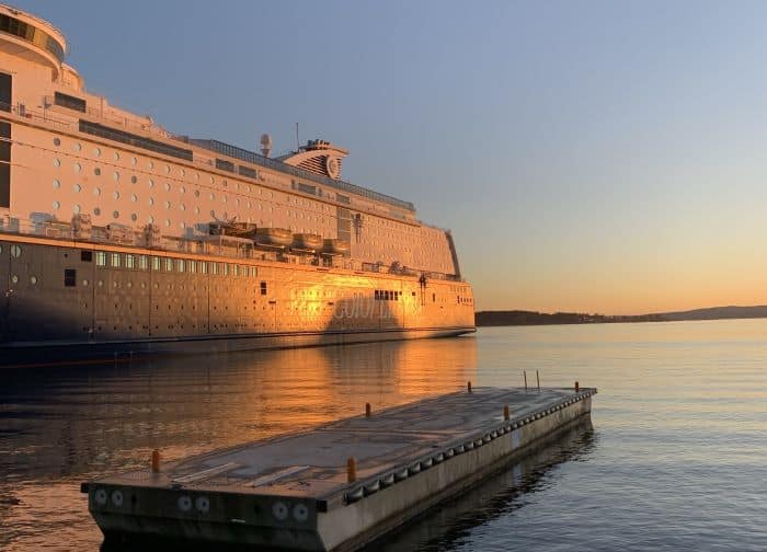 The ferry between Oslo and Denmark in the blank Oslo Fjord at sunset