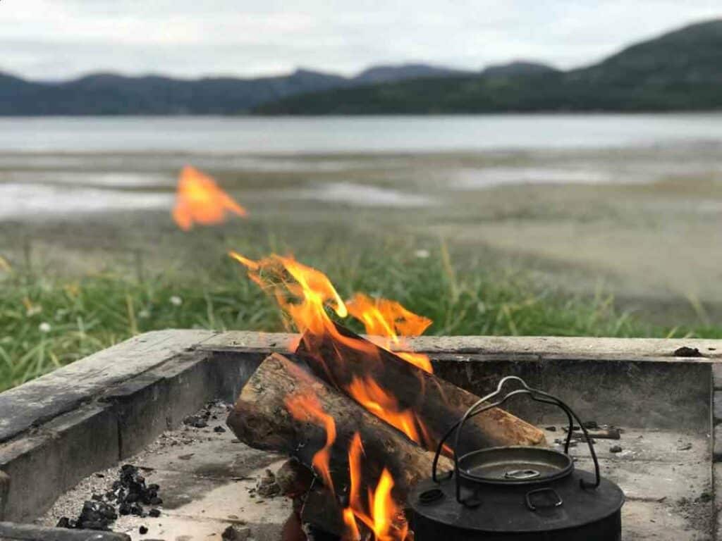 A bond fire outside Alta in Finnmark Norway, with the mountains in the background. 