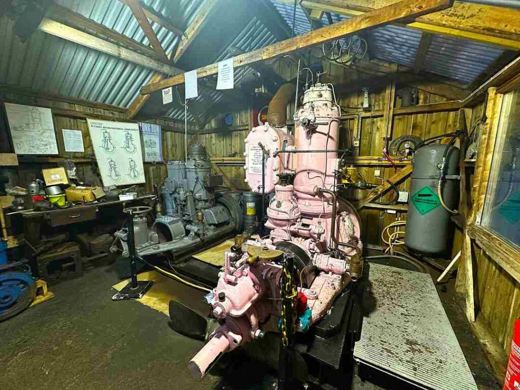 A huge pink machine to operate the blacksmith shop in a wooden cottage in Lofoten Norway