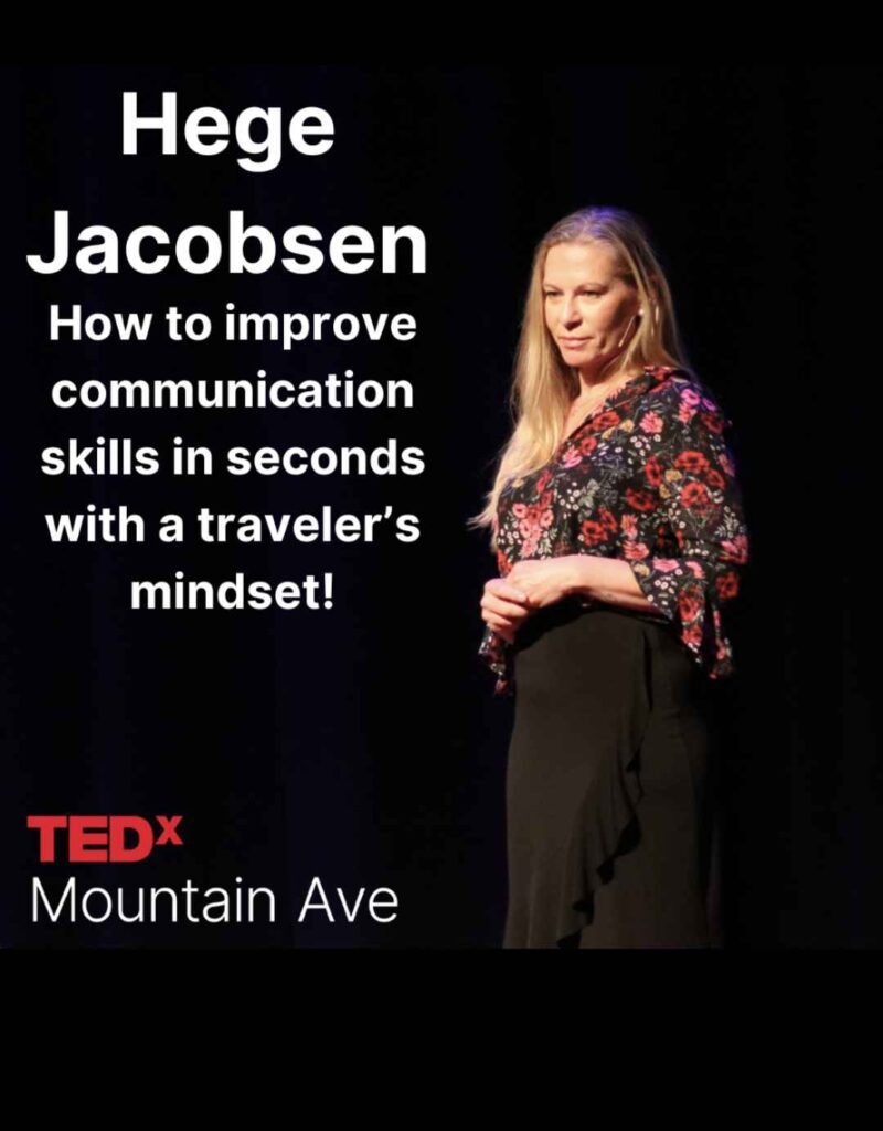 the author on a stage giving a TEDx talk about travel. 